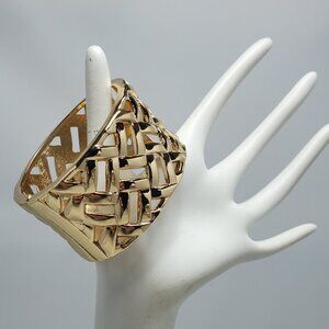 Bijou gold woven ribbon design hinge closure metal bracelet